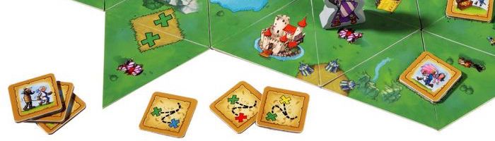 Two green Xs on the main board. Three tiles that each picture a green X and an X of another color