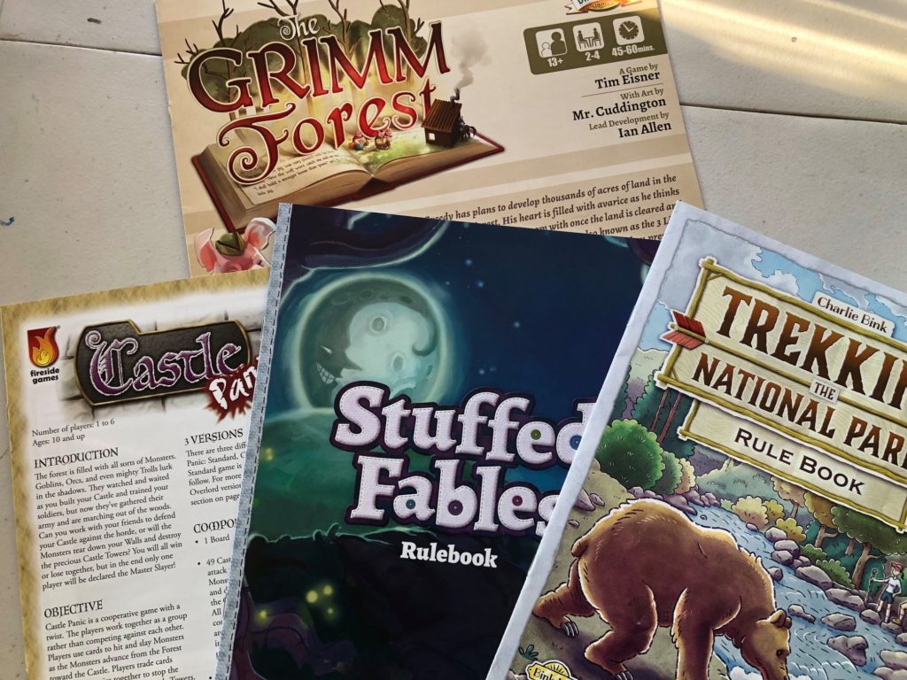 Rulebooks: The Grimm Forest, Castle Panic, Stuffed Fables, Trekking the National Parks
